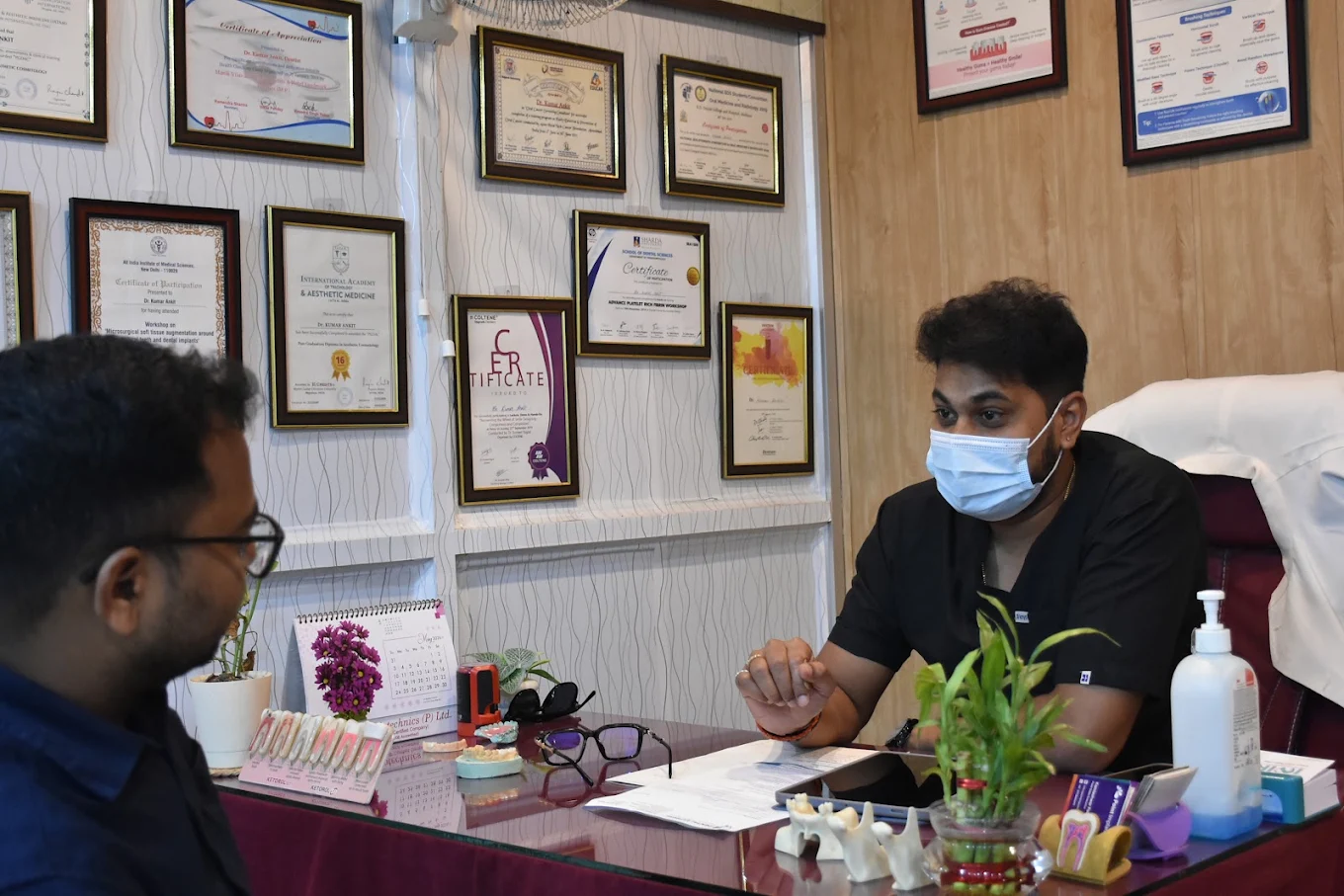 Dr. Kumar Ankitt consulting with a patient at Dental Express